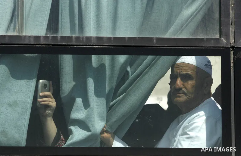 A Palestinian man sits on a bus as he crosses the Rafah border crossing August 14, 2012. Egypt opened the crossing temporarily on Tuesday, but just for three days, mainly to permit travel for humanitarian cases. The Isla...