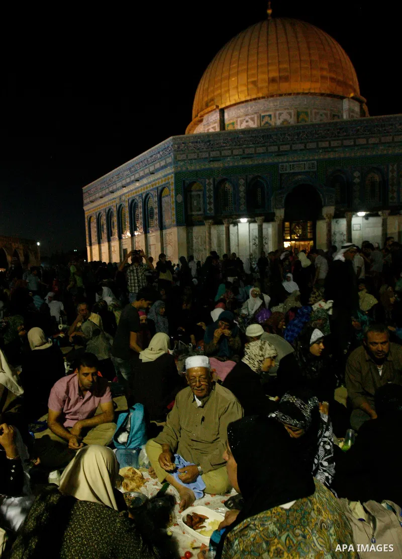 Palestinian Muslim worshippers pray during Laylat Al Qadr, also known as the Night of Power, in front of the Dome of the Rock Mosque, in the Al Aqsa Mosque compound in Jerusalem's Old City, Tuesday Aug 14,2012. Laylat Al...