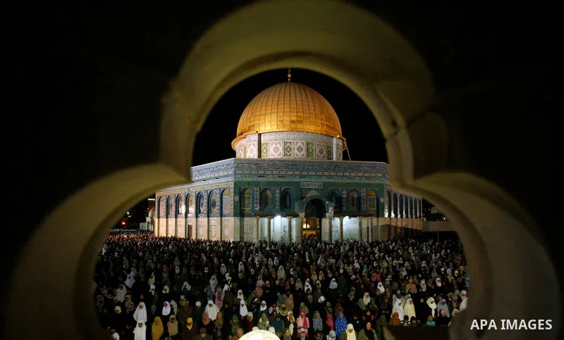 Palestinian Muslim worshippers pray during Laylat Al Qadr, also known as the Night of Power, in front of the Dome of the Rock Mosque, in the Al Aqsa Mosque compound in Jerusalem's Old City, Tuesday Aug 14,2012. Laylat Al...