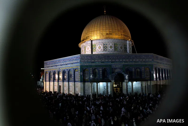 Palestinian Muslim worshippers pray during Laylat Al Qadr, also known as the Night of Power, in front of the Dome of the Rock Mosque, in the Al Aqsa Mosque compound in Jerusalem's Old City, Tuesday Aug 14,2012. Laylat Al...