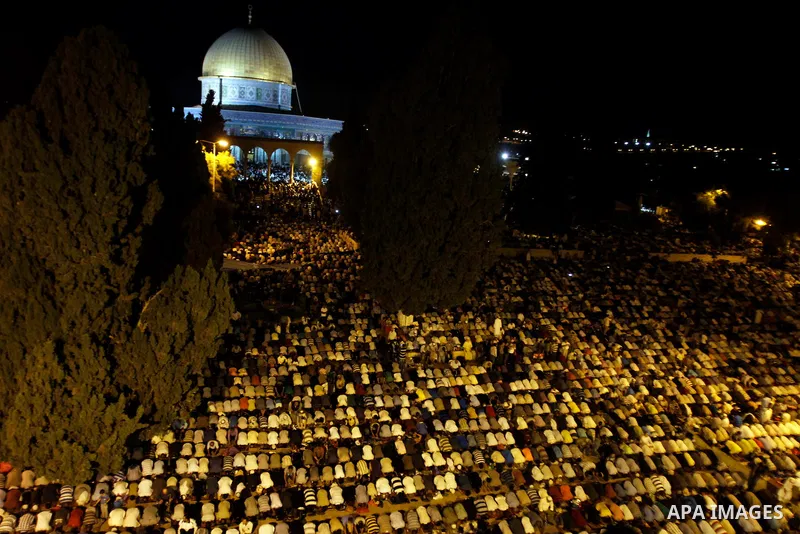 Palestinian Muslim worshippers pray during Laylat Al Qadr, also known as the Night of Power, in front of the Dome of the Rock Mosque, in the Al Aqsa Mosque compound in Jerusalem's Old City, Tuesday Aug 14,2012. Laylat Al...