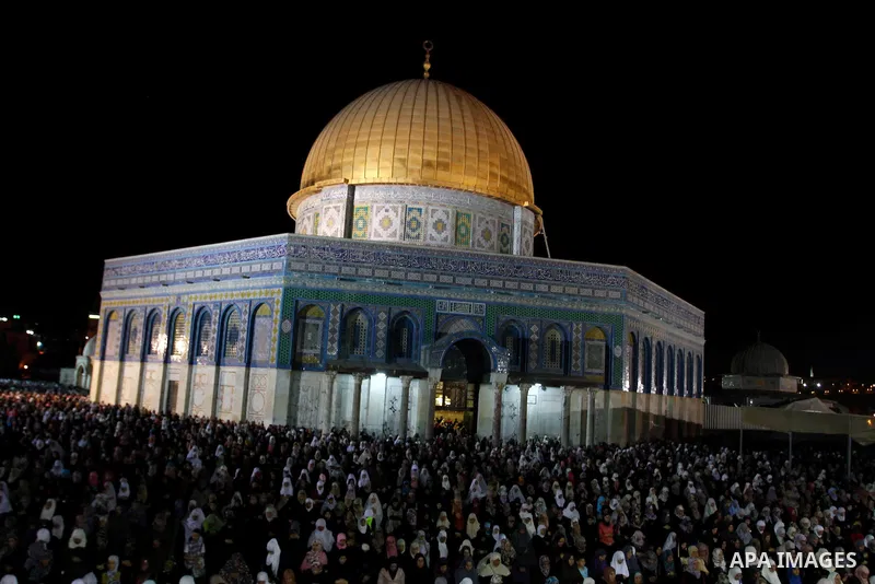 Palestinian Muslim worshippers pray during Laylat Al Qadr, also known as the Night of Power, in front of the Dome of the Rock Mosque, in the Al Aqsa Mosque compound in Jerusalem's Old City, Tuesday Aug 14,2012. Laylat Al...