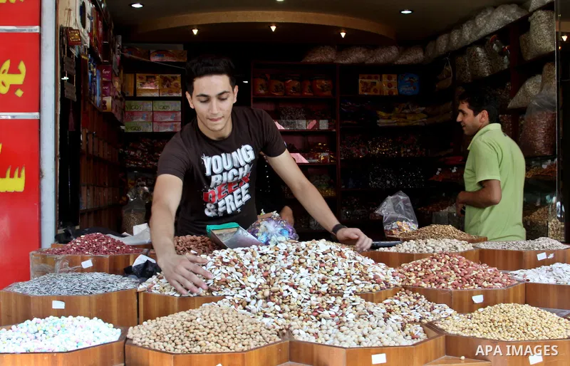 A Palestinian vendor displays his goods in the main market during preparations for the Eid Al-Fitr feast in the West Bank city of Nablus on Aug 16, 2012, as Muslims over the world prepare to celebrate Eid al-Fitr, a thre...