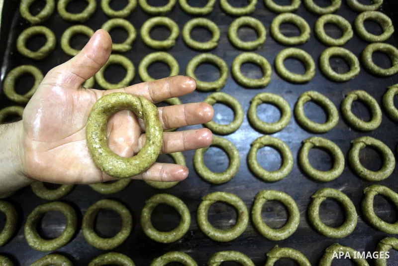 Palestinian workers make traditional date-filled cookies in preparation for the Eid al-Fitr holiday at bakery in the Gaza Strip on August 16, 2012. Muslims around the world are preparing to celebrate the Eid al-Fitr holi...
