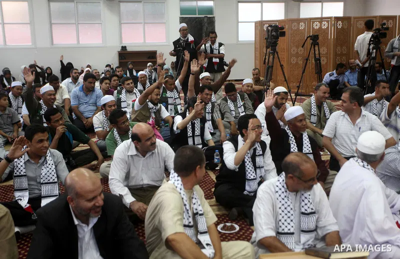 Members of " Miles of Smiles 15 " aid convoy meets with members of Palestinian Parliament at a mosque before breaking their fast during the holy month of Ramadan in Gaza city, on Aug 16, 2012. Photo by Ashraf Amra
