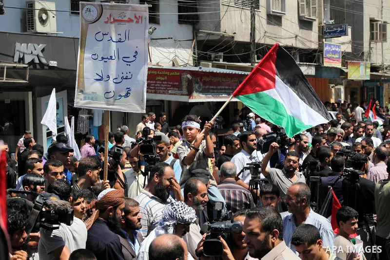 Palestinian demonstrators take part in an annual rally marking Al-Quds Day (Jerusalem Day) , on the last Friday of the holy month of Ramadan, in Gaza city, Friday, Aug. 17, 2012. Photo by Ashraf Amra