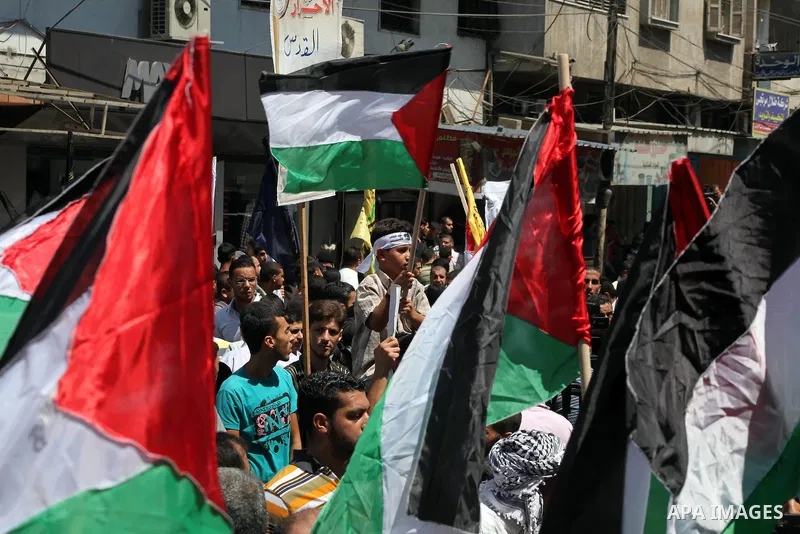 Palestinian demonstrators take part in an annual rally marking Al-Quds Day (Jerusalem Day) , on the last Friday of the holy month of Ramadan, in Gaza city, Friday, Aug. 17, 2012. Photo by Ashraf Amra