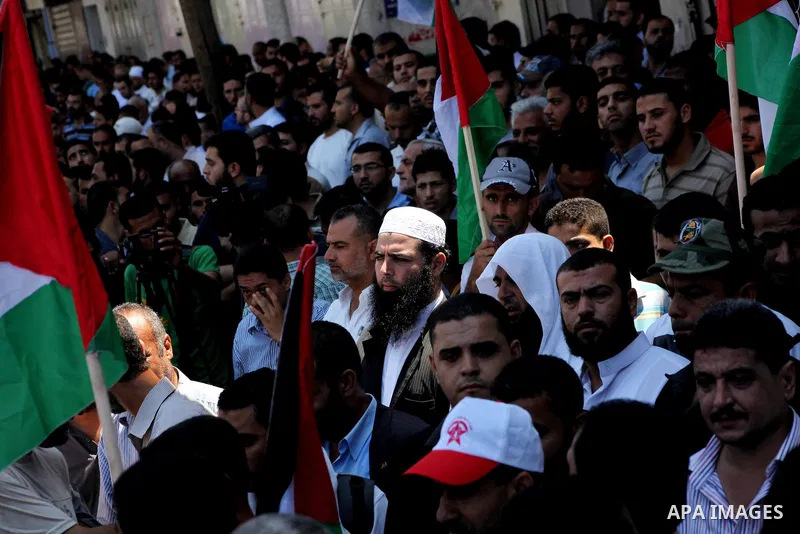 Palestinian demonstrators take part in an annual rally marking Al-Quds Day (Jerusalem Day) , on the last Friday of the holy month of Ramadan, in Gaza city, Friday, Aug. 17, 2012. Photo by Ashraf Amra