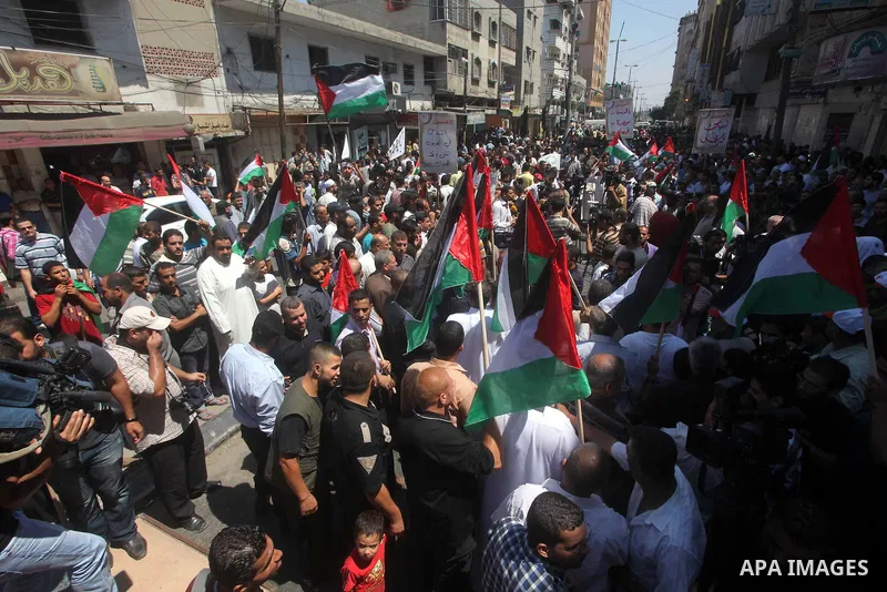 Palestinian demonstrators take part in an annual rally marking Al-Quds Day (Jerusalem Day) , on the last Friday of the holy month of Ramadan, in Gaza city, Friday, Aug. 17, 2012. Photo by Ashraf Amra