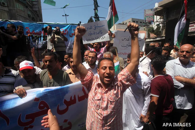 Palestinian demonstrators chant slogans during an annual rally marking Al-Quds Day (Jerusalem Day), on the last Friday of the holy month of Ramadan, in Gaza city, Friday, Aug. 17, 2012. Photo by Ashraf Amra