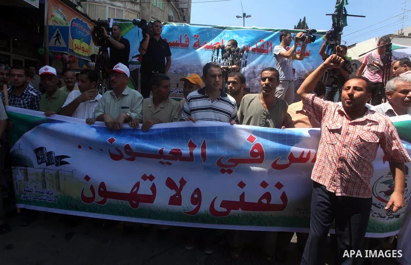 Palestinian demonstrators chant slogans during an annual rally marking Al-Quds Day (Jerusalem Day), on the last Friday of the holy month of Ramadan, in Gaza city, Friday, Aug. 17, 2012. Photo by Ashraf Amra