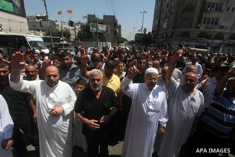 Palestinian demonstrators chant slogans during an annual rally marking Al-Quds Day (Jerusalem Day), on the last Friday of the holy month of Ramadan, in Gaza city, Friday, Aug. 17, 2012. Photo by Ashraf Amra
