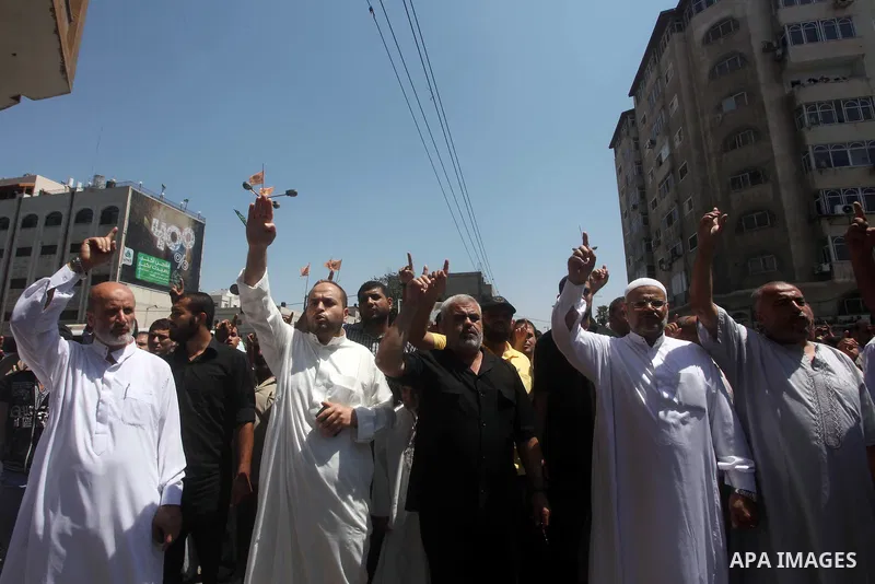 Palestinian demonstrators chant slogans during an annual rally marking Al-Quds Day (Jerusalem Day), on the last Friday of the holy month of Ramadan, in Gaza city, Friday, Aug. 17, 2012. Photo by Ashraf Amra