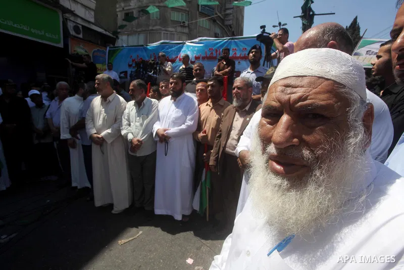 Palestinian demonstrators take part in an annual rally marking Al-Quds Day (Jerusalem Day) , on the last Friday of the holy month of Ramadan, in Gaza city, Friday, Aug. 17, 2012. Photo by Ashraf Amra