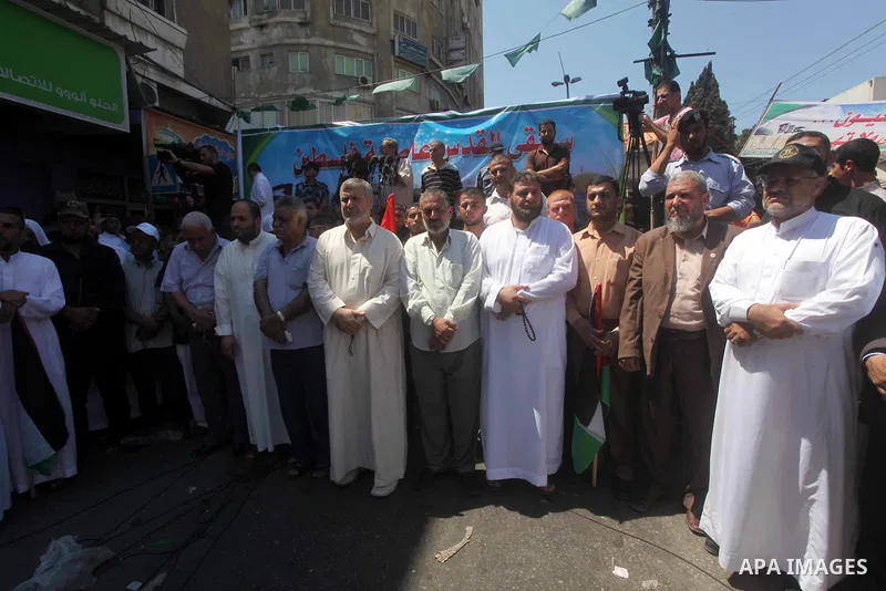 Palestinian demonstrators take part in an annual rally marking Al-Quds Day (Jerusalem Day) , on the last Friday of the holy month of Ramadan, in Gaza city, Friday, Aug. 17, 2012. Photo by Ashraf Amra