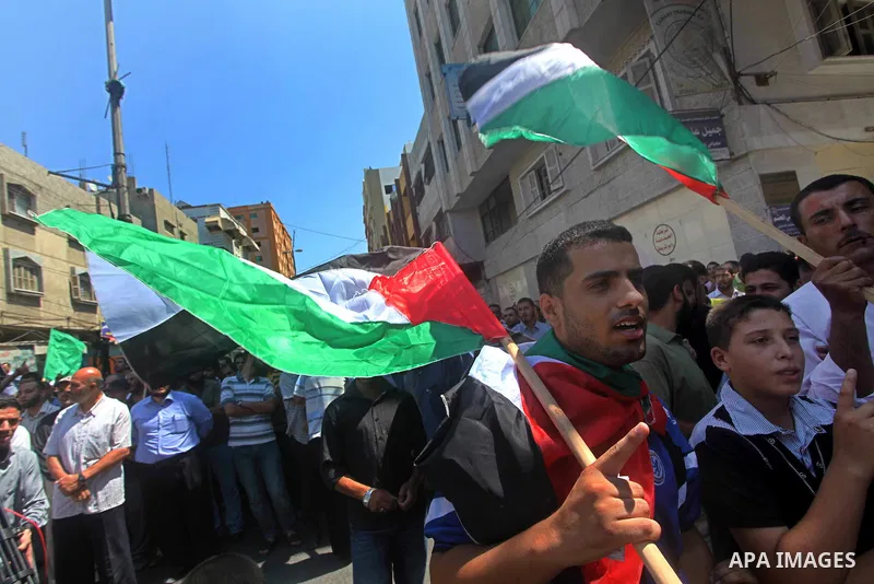 Palestinian demonstrators take part in an annual rally marking Al-Quds Day (Jerusalem Day) , on the last Friday of the holy month of Ramadan, in Gaza city, Friday, Aug. 17, 2012. Photo by Ashraf Amra