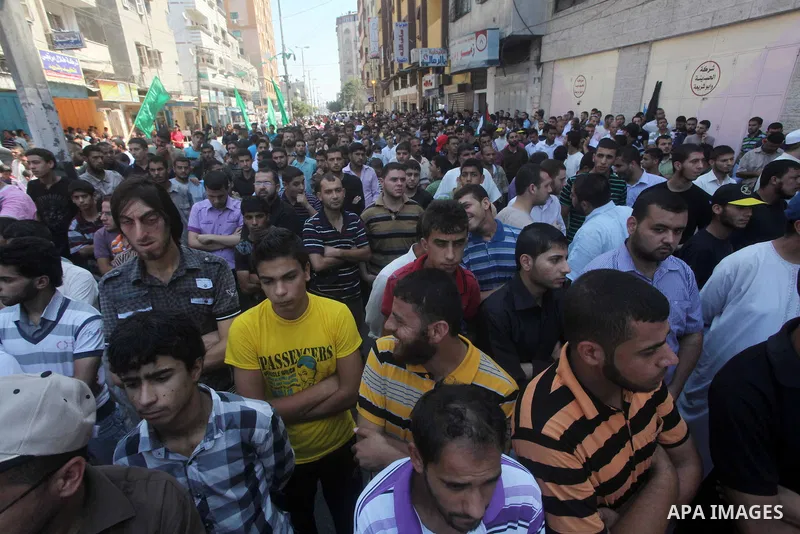 Palestinian demonstrators take part in an annual rally marking Al-Quds Day (Jerusalem Day) , on the last Friday of the holy month of Ramadan, in Gaza city, Friday, Aug. 17, 2012. Photo by Ashraf Amra