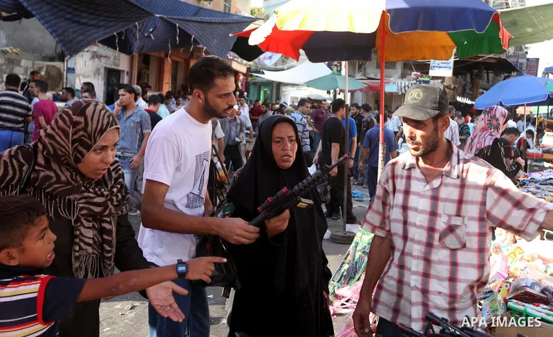 Palestinians buy toys at the main market during preparations for the Eid Al-Fitr feast Gaza city on Aug 18, 2012, as Muslims over the world prepare to celebrate Eid al-Fitr, a three day holiday marking the end of the rel...