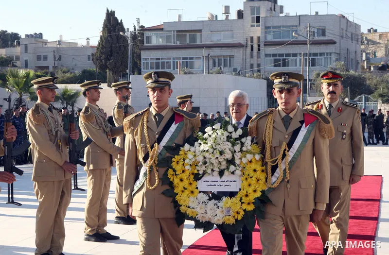 Palestinian President Mahmoud Abbas puts a wreath on the tomb of Yasser Arafat, PLO chairman and former Palestinian President, in the West Bank city of Ramallah on on Aug. 19, 2012, marking the Eid al-Fitr holiday. Musli...