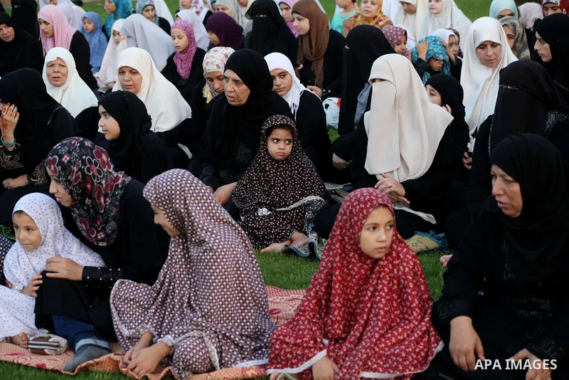 Palestinians attend Eid al-Fitr prayers at the Palestine Stadium in Gaza City August 19, 2012. Eid al-Fitr marks the end of the Muslim holy month of Ramadan. Photo by Ashraf Amra