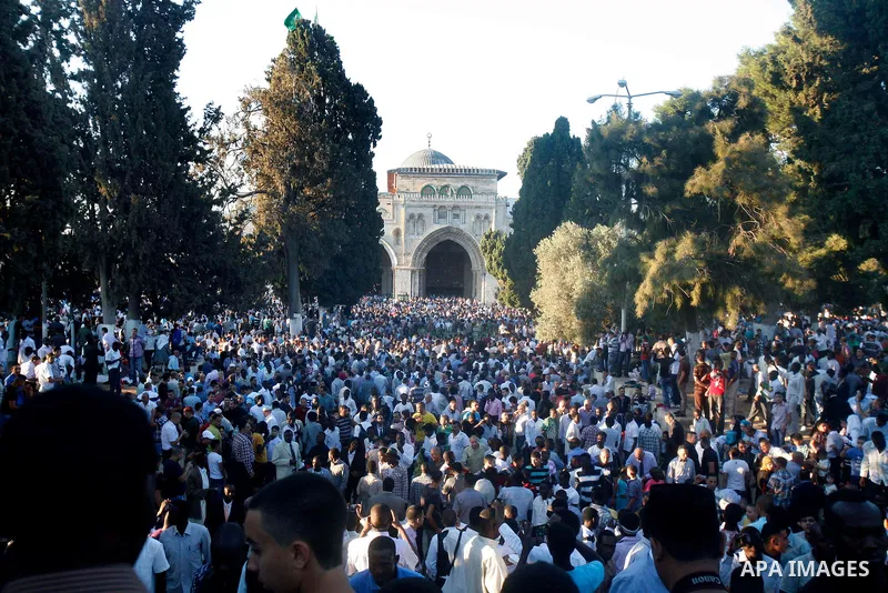 Palestinians attend the Eid al-Fitr prayers at al-Aqsa mosque in Jerusalem's Old City, Sunday, Aug. 19, 2012. Muslims are celebrating the festival of Eid al-Fitr which marks the end of the holy fasting month of Ramadan....