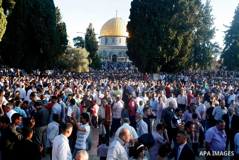 Palestinians attend the Eid al-Fitr prayers at al-Aqsa mosque in Jerusalem's Old City, Sunday, Aug. 19, 2012. Muslims are celebrating the festival of Eid al-Fitr which marks the end of the holy fasting month of Ramadan....