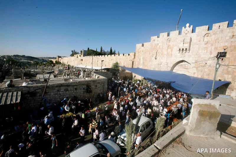 Palestinians attend the Eid al-Fitr prayers at al-Aqsa mosque in Jerusalem's Old City, Sunday, Aug. 19, 2012. Muslims are celebrating the festival of Eid al-Fitr which marks the end of the holy fasting month of Ramadan....
