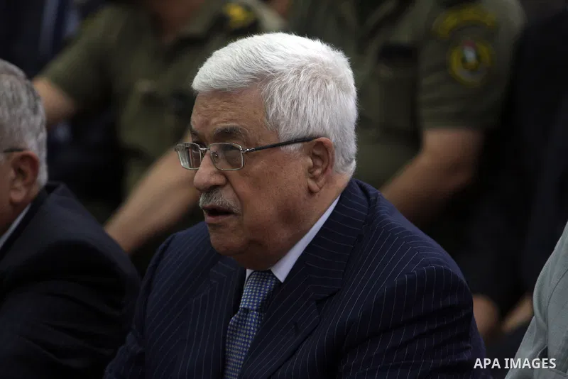 Palestinian President Mahmoud Abbas and his Prime Minister Salam Fayyad attend the early morning Eid Al-Fitr prayer at the Palestinian Authority headquarters in the West Bank city of Ramallah on Aug. 19, 2012 . Muslims o...