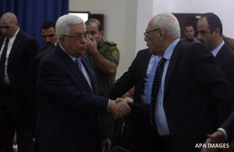 Palestinian President Mahmoud Abbas and his Prime Minister Salam Fayyad attend the early morning Eid Al-Fitr prayer at the Palestinian Authority headquarters in the West Bank city of Ramallah on Aug. 19, 2012 . Muslims o...