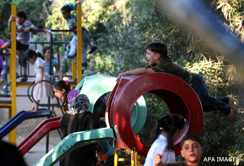 Palestinian children play at a park during the Second day of Eid al-Fitr in Gaza city, Aug. 20, 2012. which marks the end of the Muslim fasting month of Ramadan. Eid, one of the most important holidays in the Muslim worl...