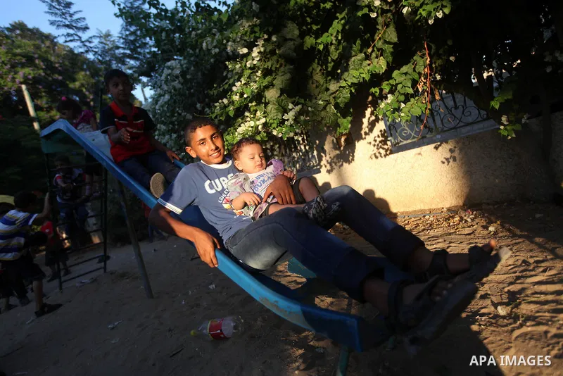 Palestinian children play at a park during the Second day of Eid al-Fitr in Gaza city, Aug. 20, 2012. which marks the end of the Muslim fasting month of Ramadan. Eid, one of the most important holidays in the Muslim worl...