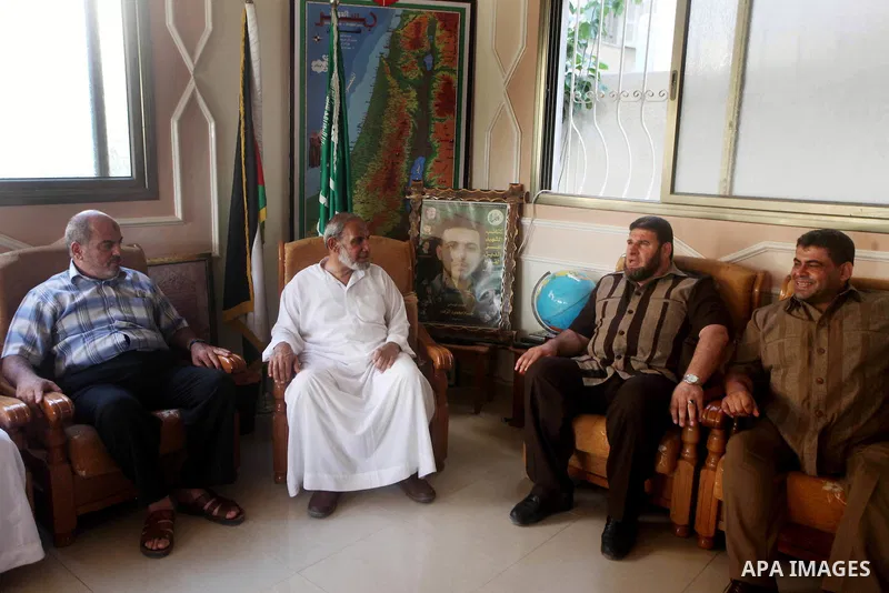 Palestinian Hamas leader Mahmoud al-Zahar recieves congratulations of Eid al-Fitr at his house in Gaza city, Aug. 20, 2012. which marks the end of the Muslim fasting month of Ramadan. Eid, one of the most important holid...
