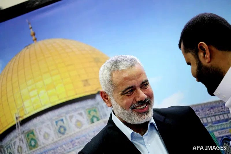 Palestinian Prime Minister in Gaza Ismail Haniyeh recieves congratulations of Eid al-Fitr in Gaza city, Aug. 20, 2012. which marks the end of the Muslim fasting month of Ramadan. Eid, one of the most important holidays i...