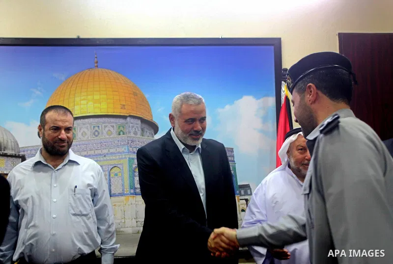 Palestinian Prime Minister in Gaza Ismail Haniyeh recieves congratulations of Eid al-Fitr in Gaza city, Aug. 20, 2012. which marks the end of the Muslim fasting month of Ramadan. Eid, one of the most important holidays i...