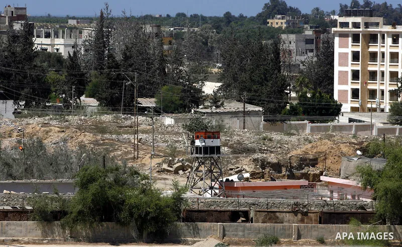 A view of soldiers from the Egyptian army destroying the infrastructure of smuggling tunnels along the Egypt-Gaza border is seen from Rafah, southern Gaza Strip, on August 22, 2012, as sources in Cairo suggested some of...