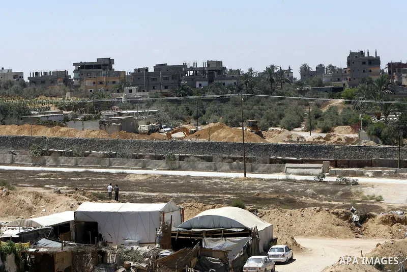 A view of tents covering the smuggling tunnels along the Egypt-Gaza border is seen from Rafah, southern Gaza Strip, on August 22, 2012, as Egyptian soldiers destroy the infrastructure of the tunnels on the Egyptian side...