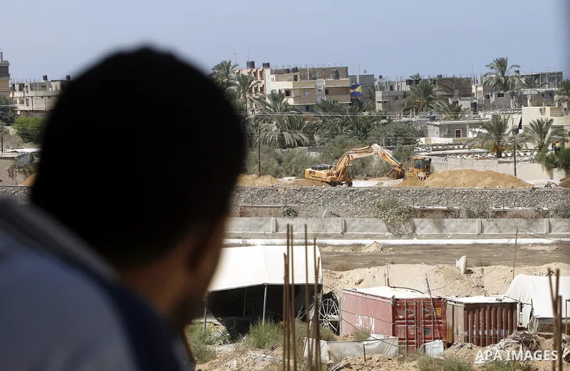 A view of soldiers from the Egyptian army destroying the infrastructure of smuggling tunnels along the Egypt-Gaza border is seen from Rafah, southern Gaza Strip, on August 22, 2012, as sources in Cairo suggested some of...