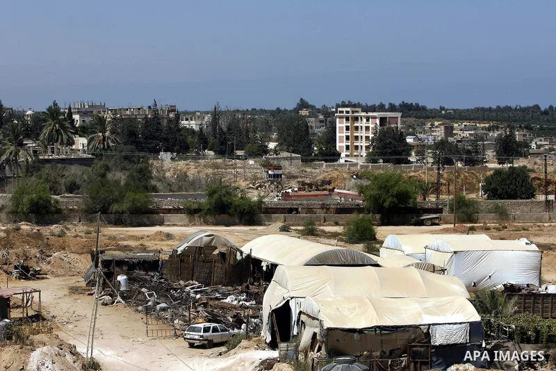 A view of tents covering the smuggling tunnels along the Egypt-Gaza border is seen from Rafah, southern Gaza Strip, on August 22, 2012, as Egyptian soldiers destroy the infrastructure of the tunnels on the Egyptian side...