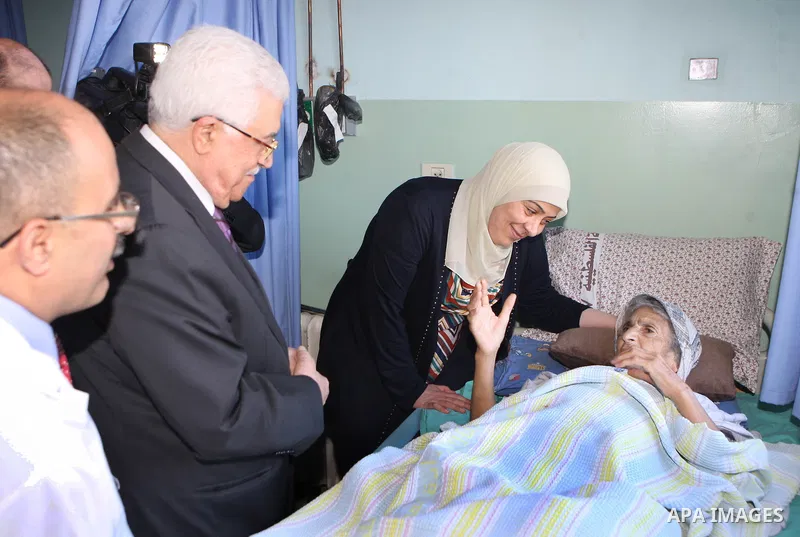 Palestinian President Mahmoud Abbas ( Abu Mazen ) visits patients in Ramallah governmental hospital in the West Bank city of Ramallah, on Aug 23, 2012. Photo by Thaer Ganaim