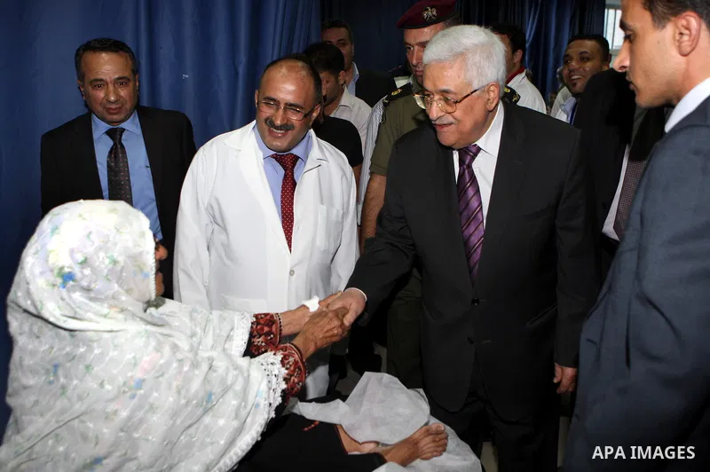 Palestinian President Mahmoud Abbas ( Abu Mazen ) visits patients in Ramallah governmental hospital in the West Bank city of Ramallah, on Aug 23, 2012. Photo by Thaer Ganaim