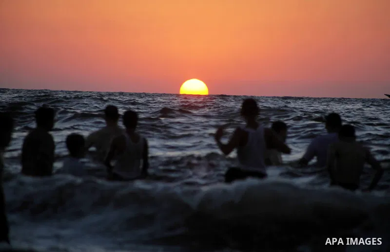 Palestinians enjoy swimming in the sea at Gaza beach during Friday holiday in Gaza city, Aug 24, 2012. Gazans escape to the beach and out from their homes during heat wave and power outages. Photo by Ashraf Amra