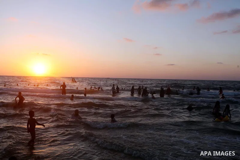 Palestinians enjoy swimming in the sea at Gaza beach during Friday holiday in Gaza city, Aug 24, 2012. Gazans escape to the beach and out from their homes during heat wave and power outages. Photo by Ashraf Amra