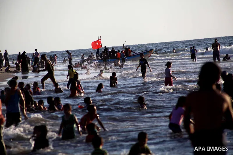 Palestinians enjoy swimming in the sea at Gaza beach during Friday holiday in Gaza city, Aug 24, 2012. Gazans escape to the beach and out from their homes during heat wave and power outages. Photo by Ashraf Amra