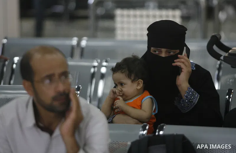 Palestinians wait inside a station at the Rafah border crossing in the southern Gaza Strip before travelling to Egypt on August 25, 2012. Egypt allowed some Palestinians to enter its territory from Gaza. Photo by Eyad Al...
