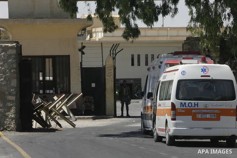 Ambulance enters into Egypt at the Rafah border crossing in the southern Gaza strip, 25 August 2012. Egypt allowed some Palestinians to enter its territory from Gaza. Photo by Eyad Al Baba