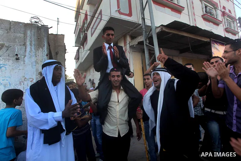 Palestinian friends and relatives celebrated the groom, Salah Khatab 25 years old, in ,Dear El-Balah, southern Gaza Strip on the eve of his wedding on August. 25, 2012, during the traditional celebration, Khatab was firs...