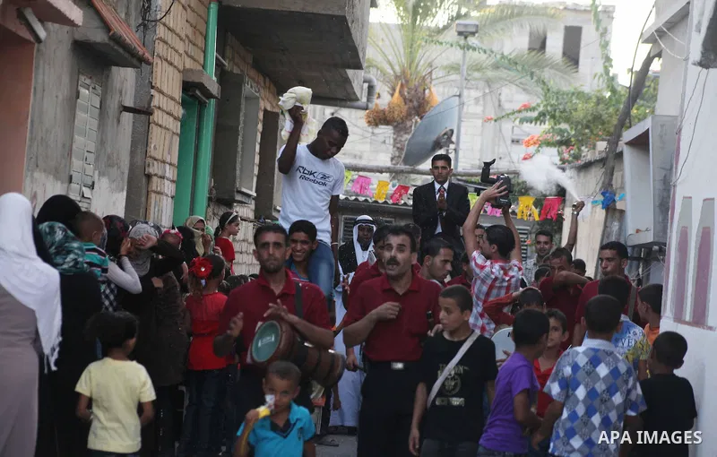 Palestinian friends and relatives celebrated the groom, Salah Khatab 25 years old, in ,Dear El-Balah, southern Gaza Strip on the eve of his wedding on August. 25, 2012, during the traditional celebration, Khatab was firs...