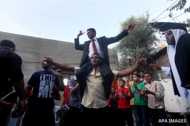 Palestinian friends and relatives celebrated the groom, Salah Khatab 25 years old, in ,Dear El-Balah, southern Gaza Strip on the eve of his wedding on August. 25, 2012, during the traditional celebration, Khatab was firs...