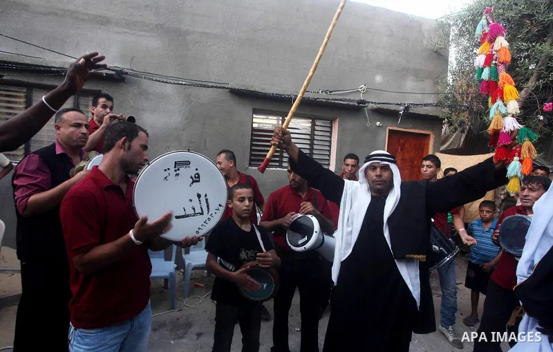 Palestinian friends and relatives celebrated the groom, Salah Khatab 25 years old, in ,Dear El-Balah, southern Gaza Strip on the eve of his wedding on August. 25, 2012, during the traditional celebration, Khatab was firs...
