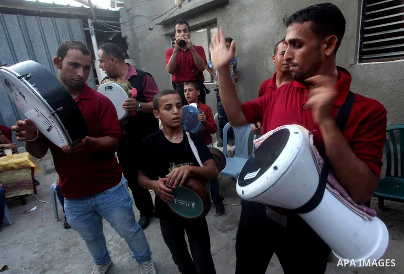 Palestinian friends and relatives celebrated the groom, Salah Khatab 25 years old, in ,Dear El-Balah, southern Gaza Strip on the eve of his wedding on August. 25, 2012, during the traditional celebration, Khatab was firs...
